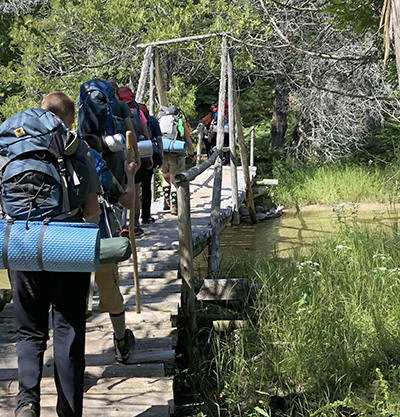 Hiking over bridge